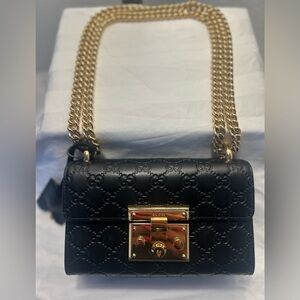 100% authentic Gucci, black padlock, shoulder bag, and purse with gold chain